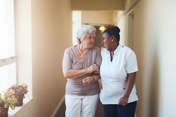 An elderly woman and her caregiver